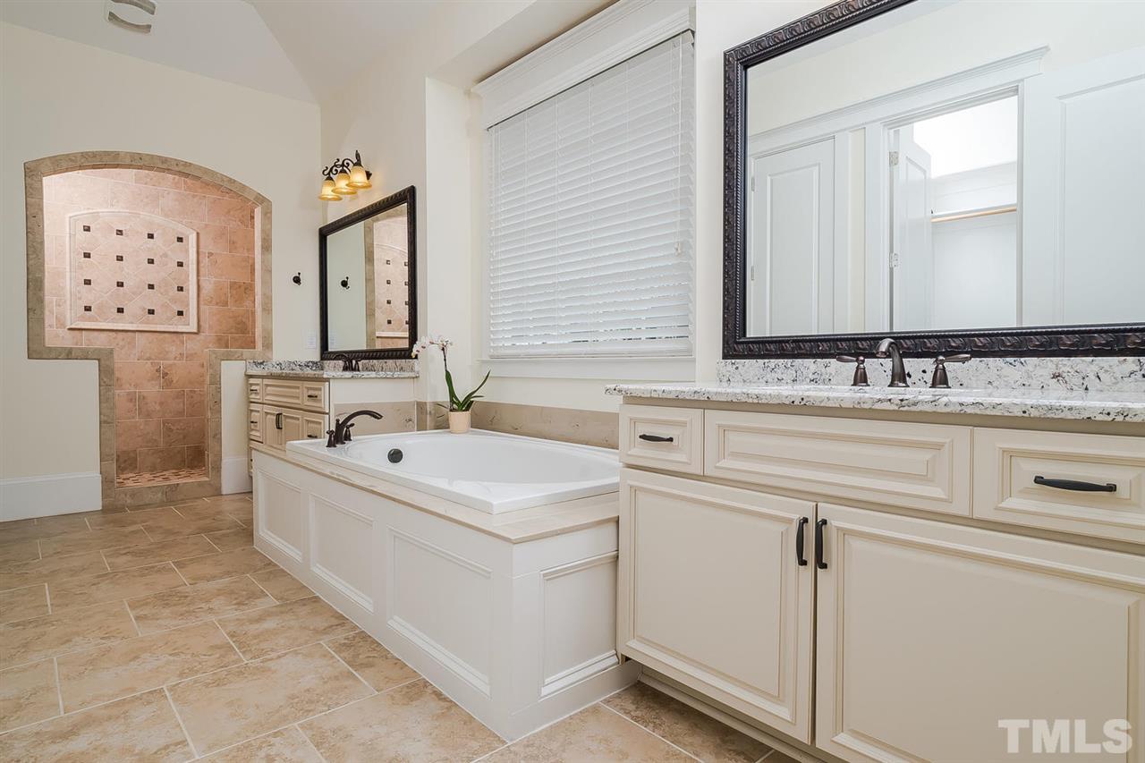 1101 Shelley Road Raleigh, NC 27609 - Photo 13 of 25 a bathroom with a sink and a mirror
