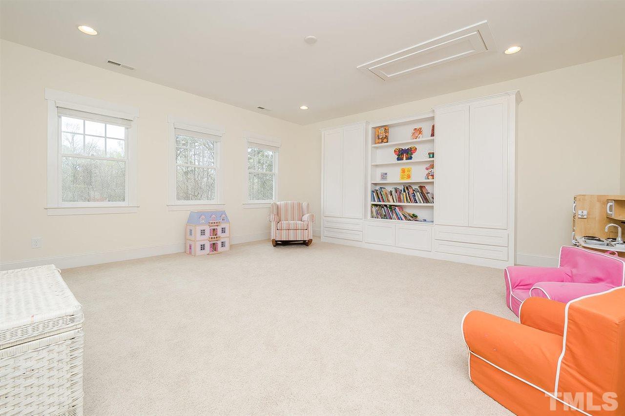 1101 Shelley Road Raleigh, NC 27609 - Photo 17 of 25 a living room with furniture and a window