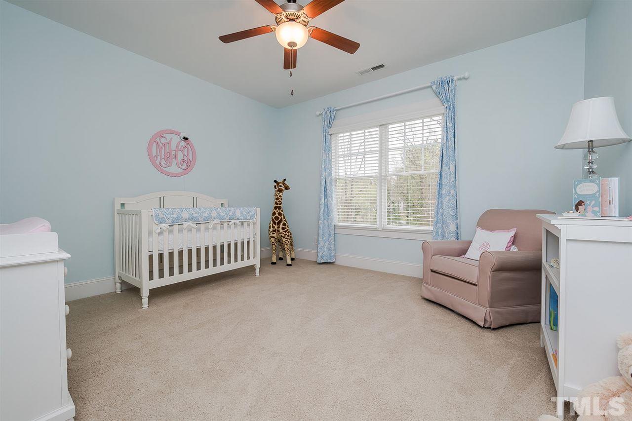 1101 Shelley Road Raleigh, NC 27609 - Photo 18 of 25 a bedroom with furniture and a window