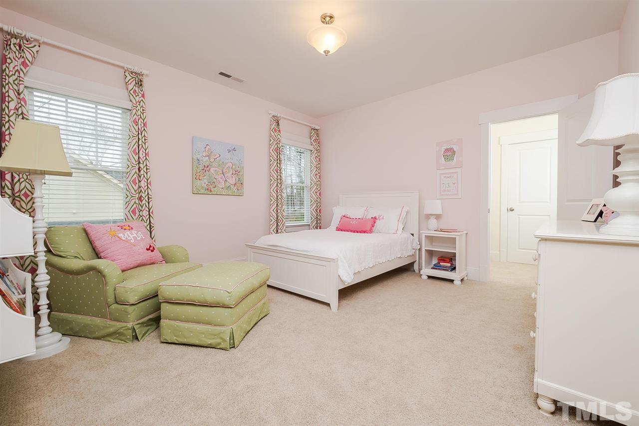 1101 Shelley Road Raleigh, NC 27609 - Photo 19 of 25 a bedroom with a bed and a couch