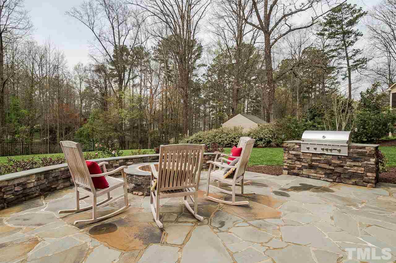 1101 Shelley Road Raleigh, NC 27609 - Photo 23 of 25 a patio with a table and chairs