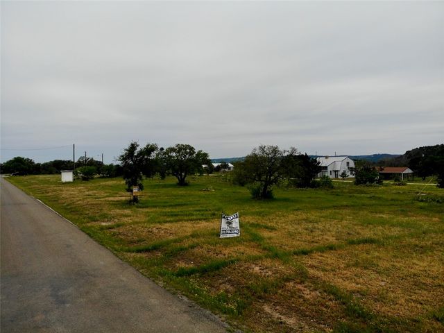 a view of a golf course with a lake