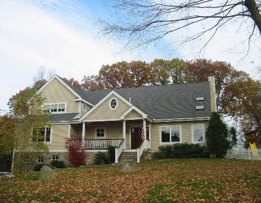 563 Webbs Hill Road Stamford, CT 06903 - Photo 1 of 1 a front view of a house with garden