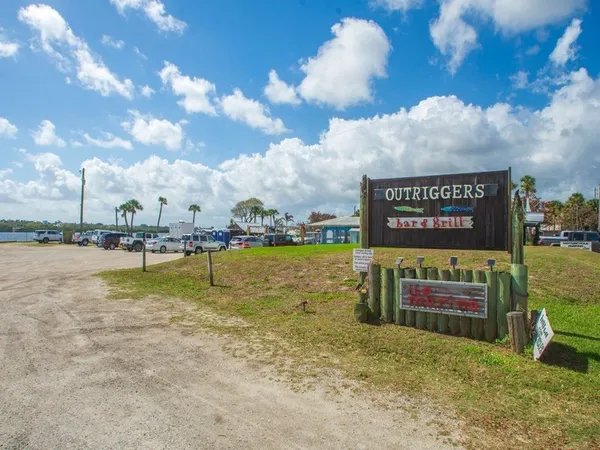 a view of a lake with boats and a view of city