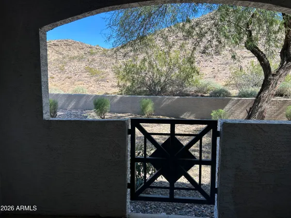a view of a yard from a balcony