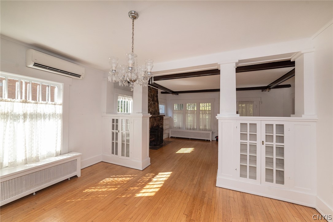 167 Beverly Road Syracuse, NY 13207 - Photo 12 of 50 Hardwood floors and character-rich built-ins define this classic, open living space.