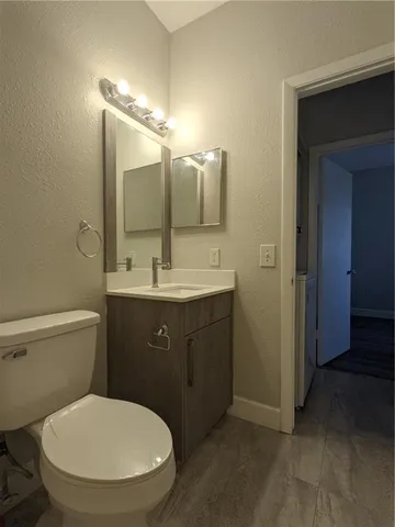 a bathroom with a sink and a large mirror