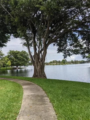 a view of a garden with a lake