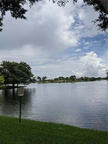a view of a lake with a yard