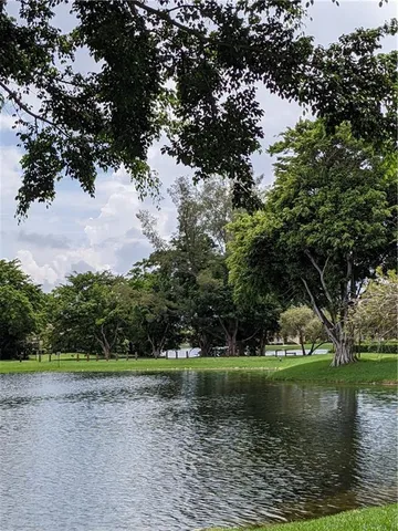 a sign that is on a green field