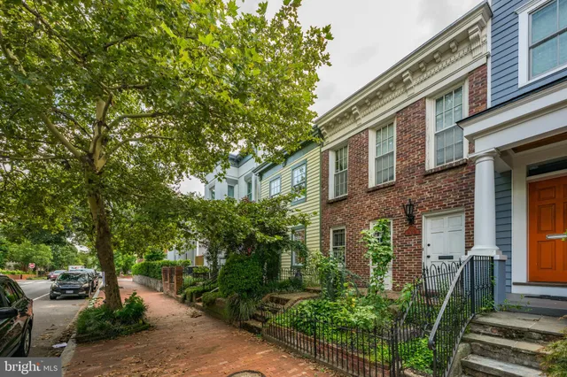 a view of a house with a tree