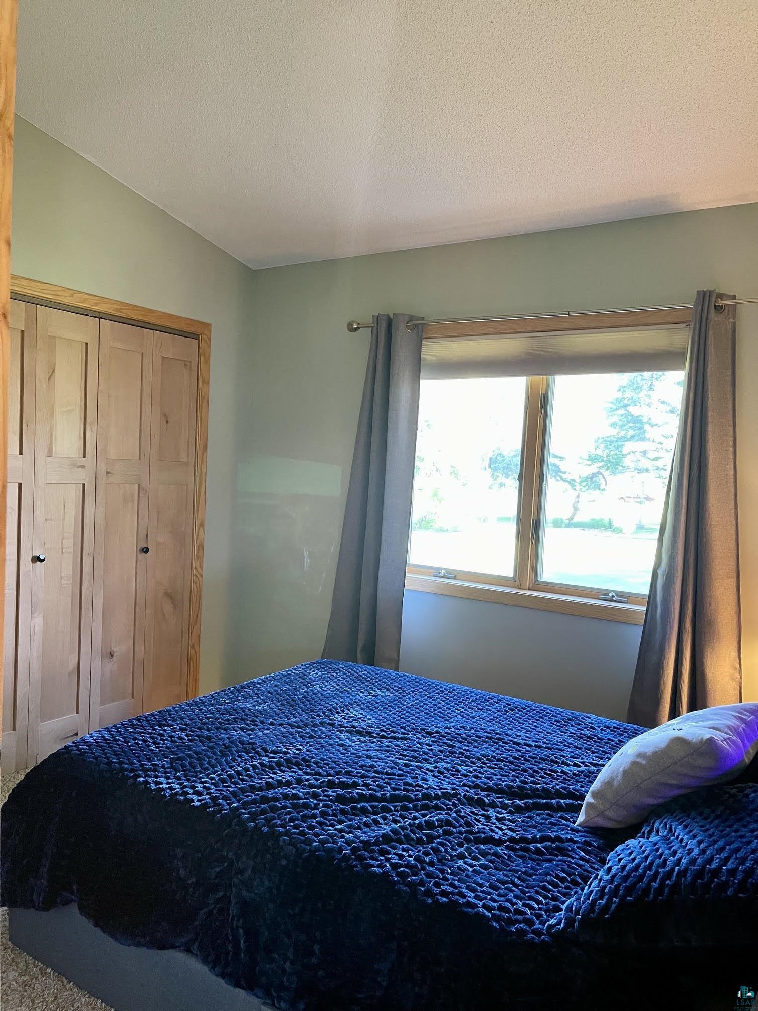 37460 Sunrise View Road Sturgeon Lake, MN 55783 - Photo 28 of 50 Middle bedroom vaulted ceilings.