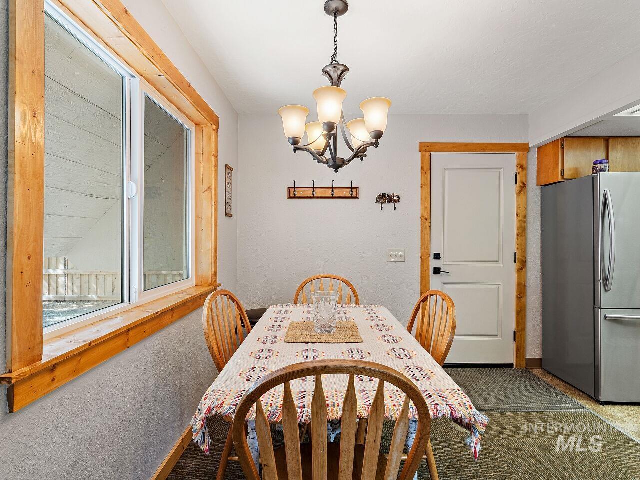 7438 Highway 95 Riggins, ID 83549 - Photo 24 of 36 Dining room featuring hanging lights and a textured wall