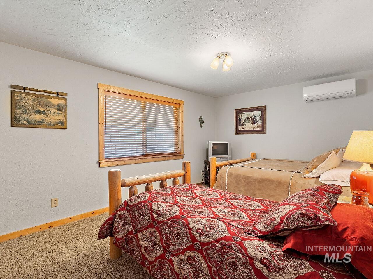 7438 Highway 95 Riggins, ID 83549 - Photo 35 of 36 Bedroom with carpet and a textured ceiling