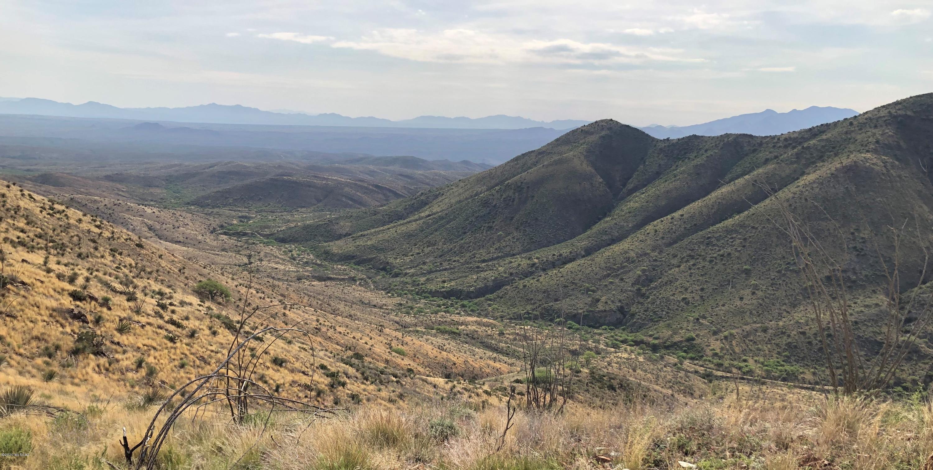 18019 East Hilton Ranch Road Vail, AZ 85641 - Photo 1 of 20 a view of a dry yard with mountains in the background