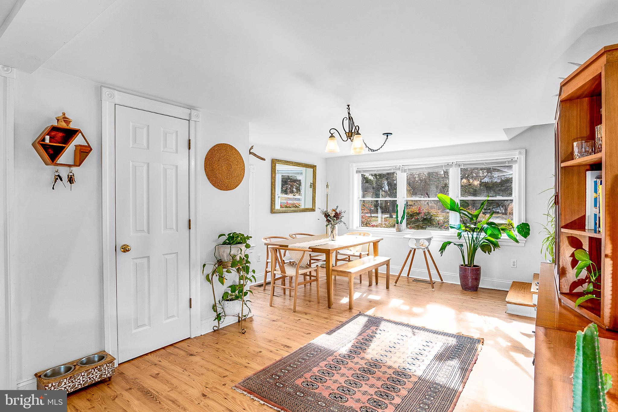 22582 Pot Pie Road Wittman, MD 21676 - Photo 16 of 33 Bright and airy dining space with greenery.