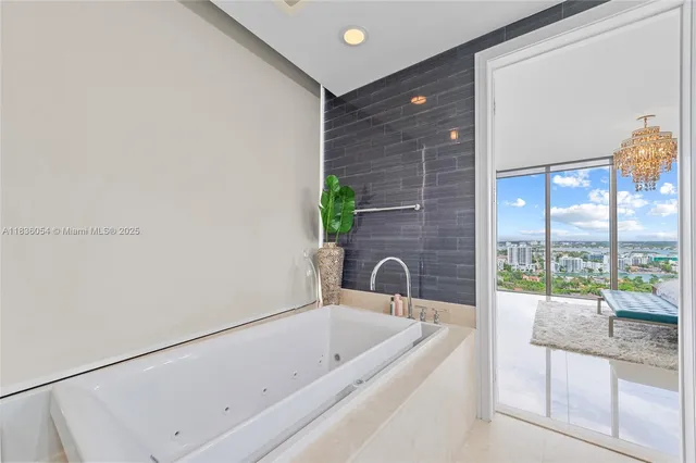 a bathroom with a bathtub and a shower