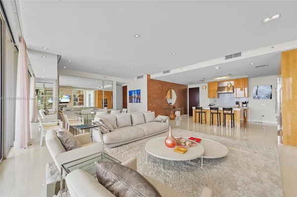 a living room with furniture and a table