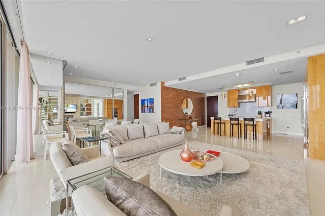 a living room with furniture and a table