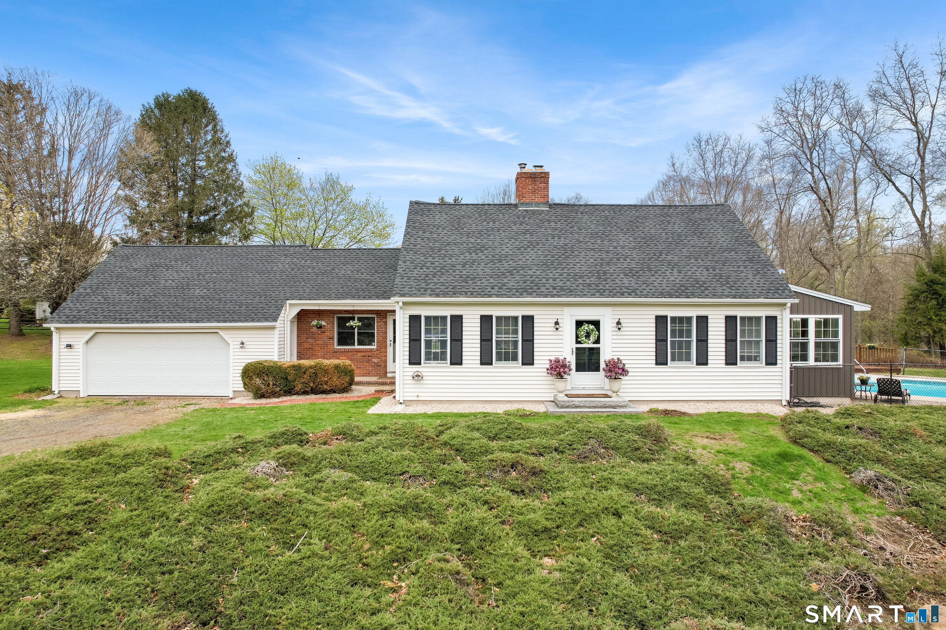 a front view of a house with a yard