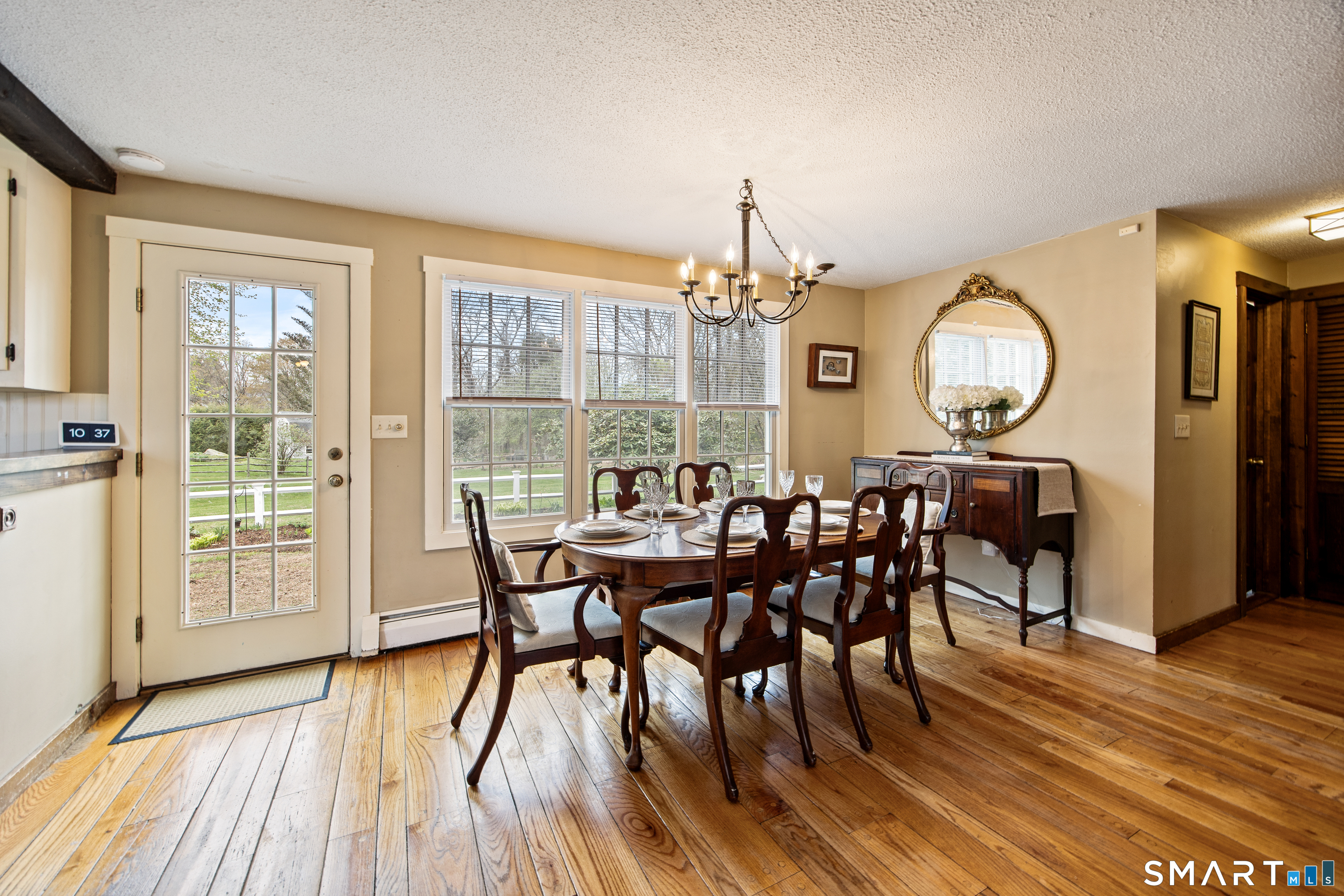 5 Livery Pool Road New Hartford, CT 06057 - Photo 14 of 40 a view of a dining room with furniture window and wooden floor