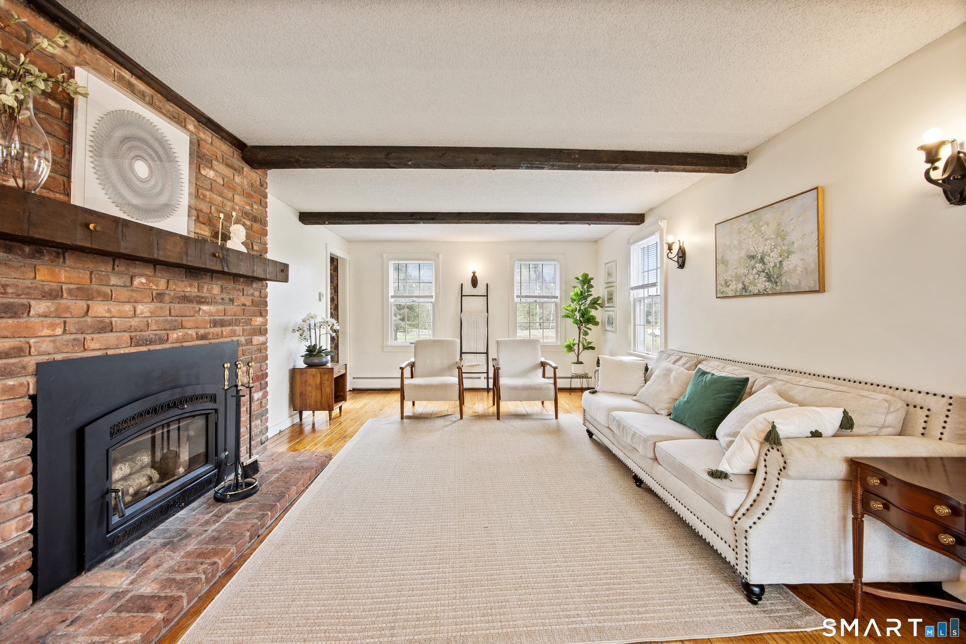 5 Livery Pool Road New Hartford, CT 06057 - Photo 17 of 40 a living room with furniture and a fireplace