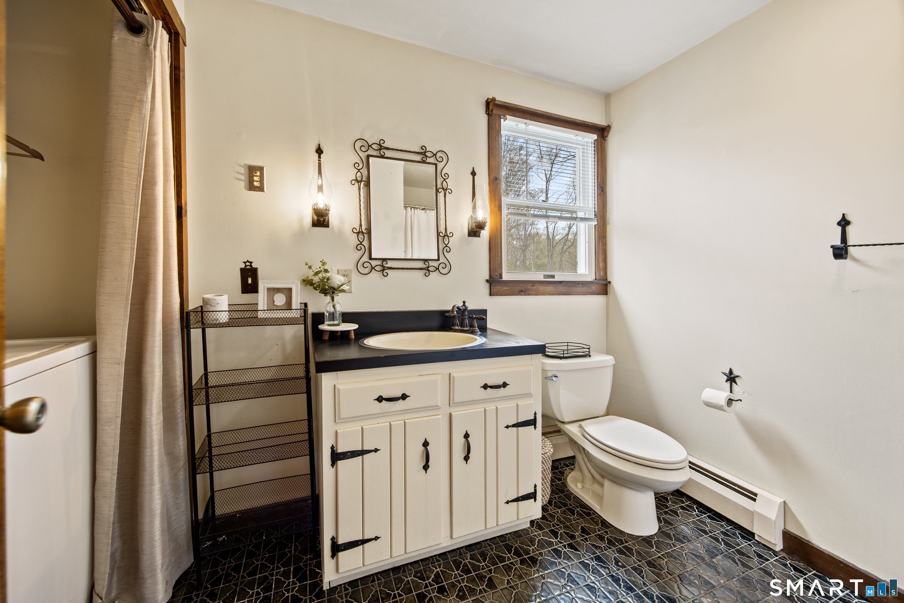 5 Livery Pool Road New Hartford, CT 06057 - Photo 19 of 40 a bathroom with a granite countertop toilet sink and mirror