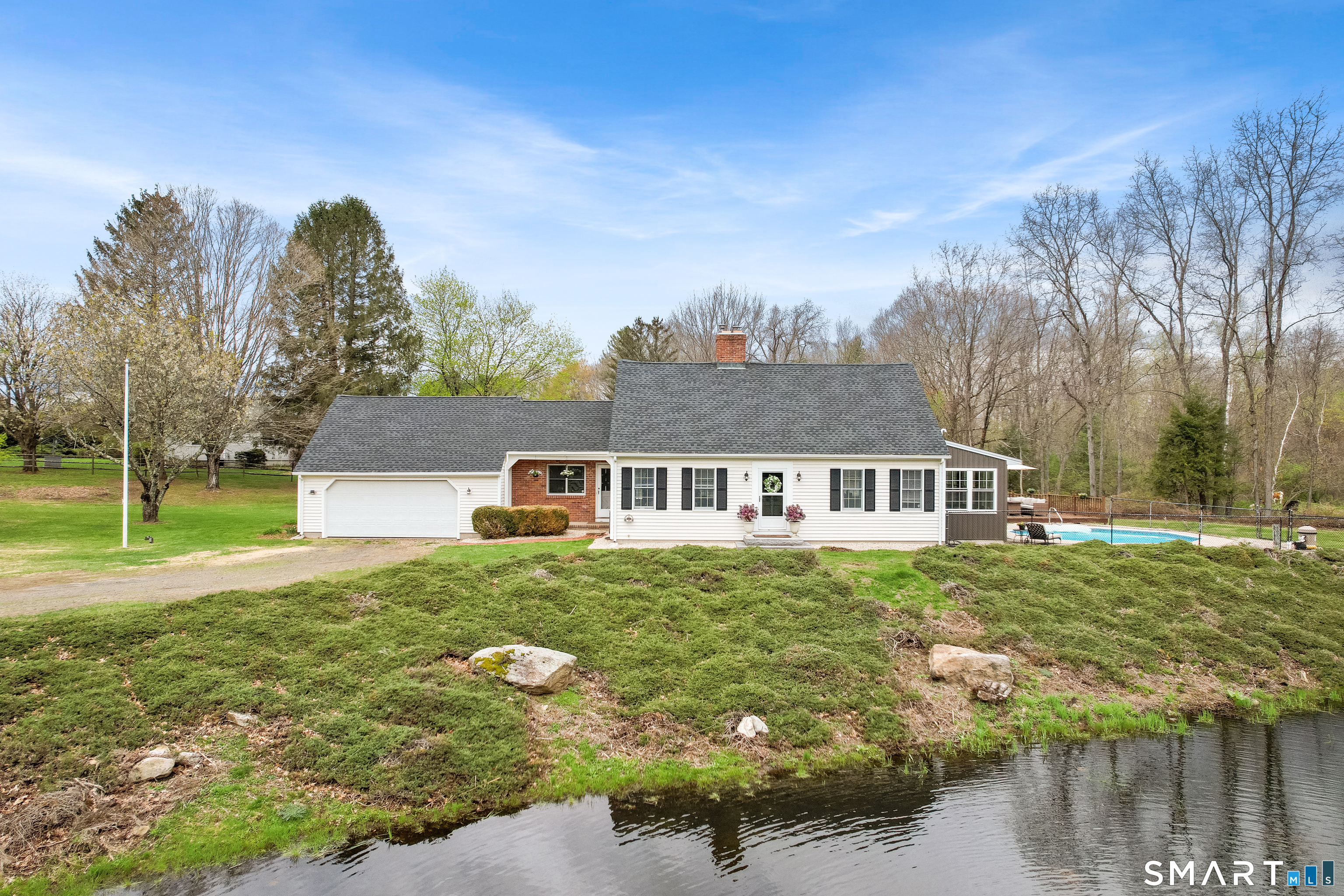 5 Livery Pool Road New Hartford, CT 06057 - Photo 2 of 40 front view of a house with a yard