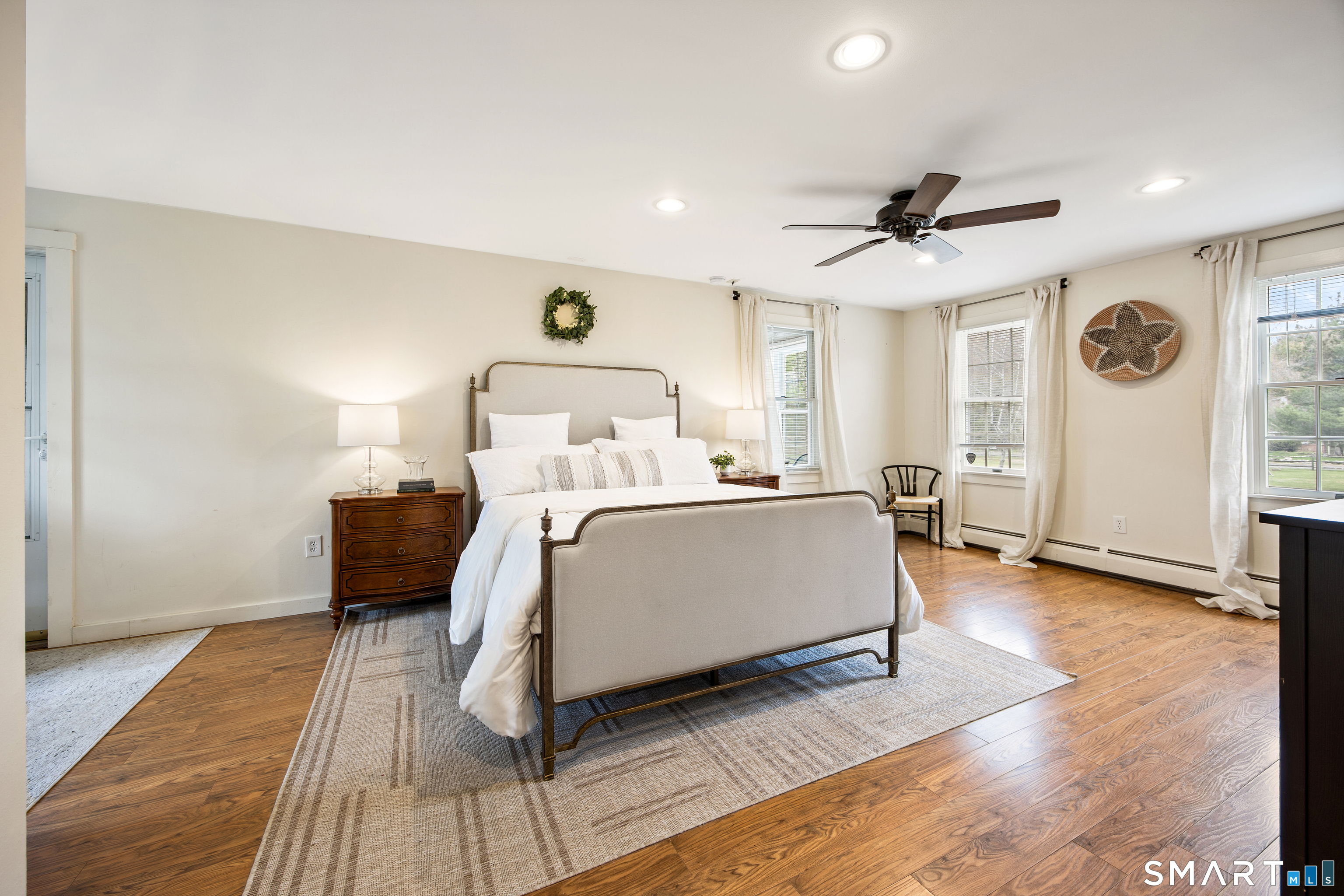 5 Livery Pool Road New Hartford, CT 06057 - Photo 21 of 40 a bedroom with a bed and a mirror