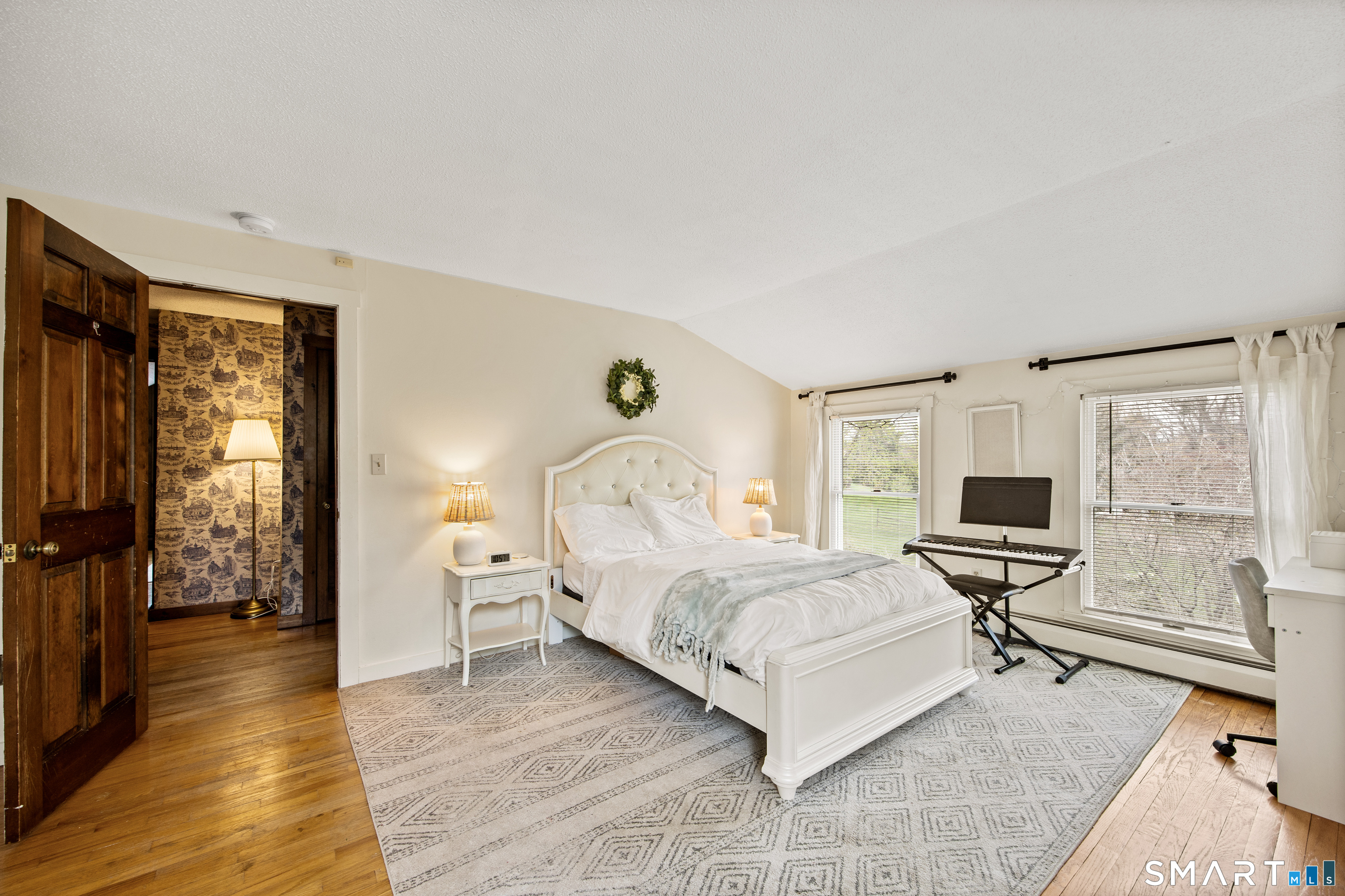 5 Livery Pool Road New Hartford, CT 06057 - Photo 26 of 40 a bedroom with a bed and wooden floor