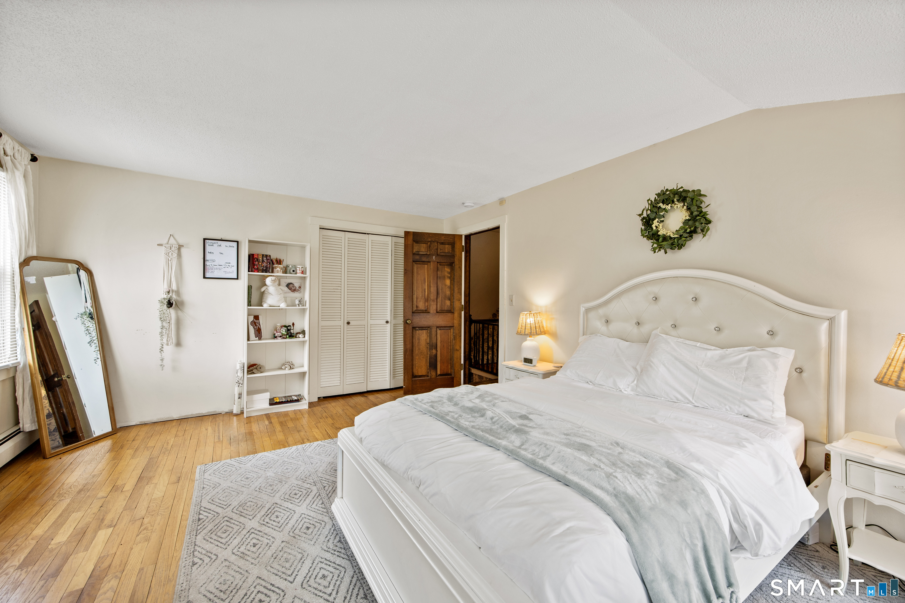 5 Livery Pool Road New Hartford, CT 06057 - Photo 27 of 40 a bedroom with a bed and a flat screen tv