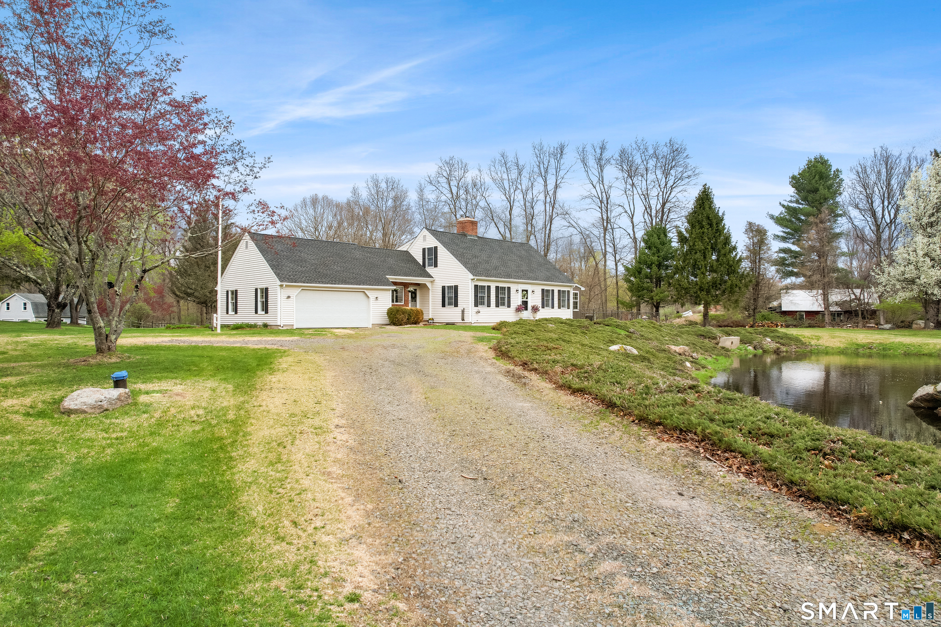 5 Livery Pool Road New Hartford, CT 06057 - Photo 3 of 40 a view of a house with a yard and sitting area