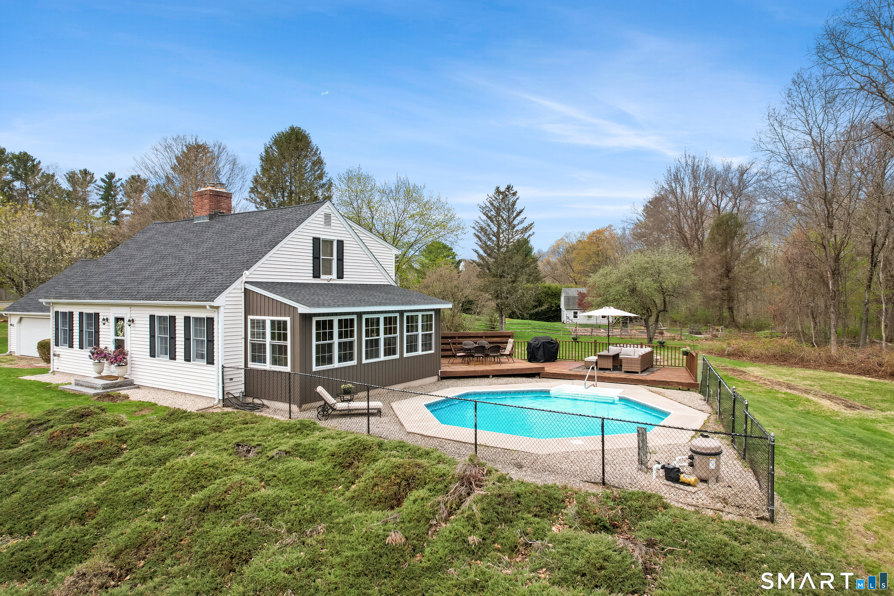 5 Livery Pool Road New Hartford, CT 06057 - Photo 5 of 40 a house view with a swimming pool and sitting space