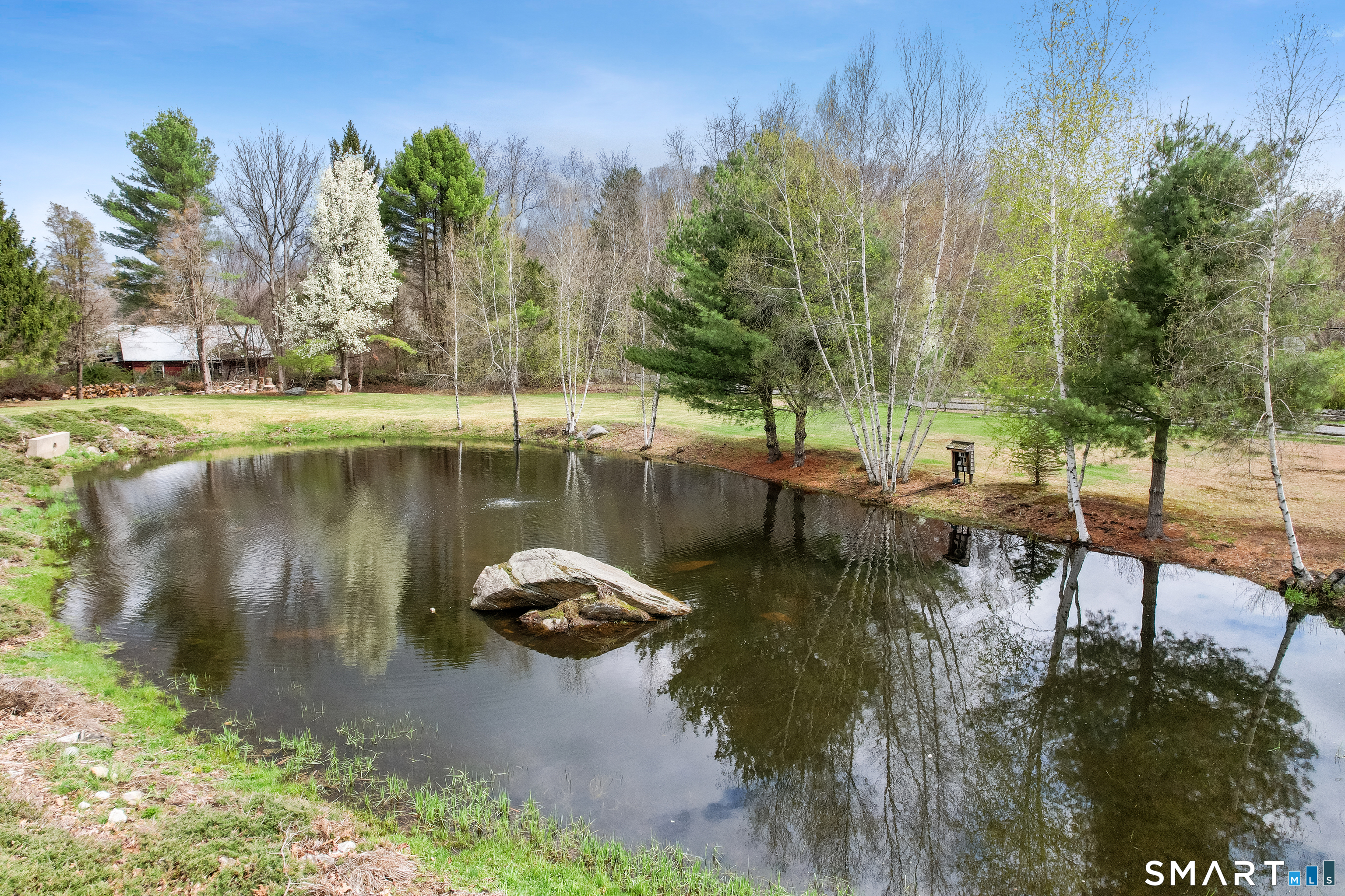 5 Livery Pool Road New Hartford, CT 06057 - Photo 8 of 40 a view of a lake with a yard