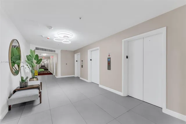 a view of empty room with a fireplace