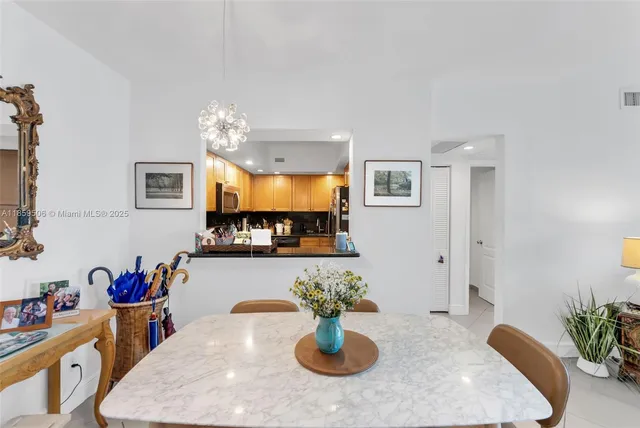 a kitchen with a table and chairs in it