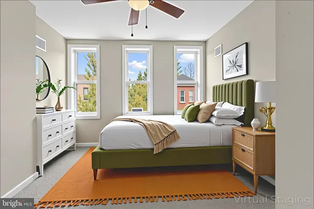 a bedroom with a bed dresser and a window