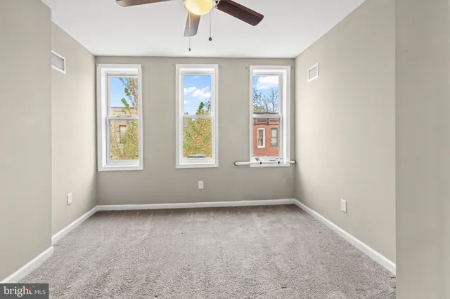 an empty room with windows