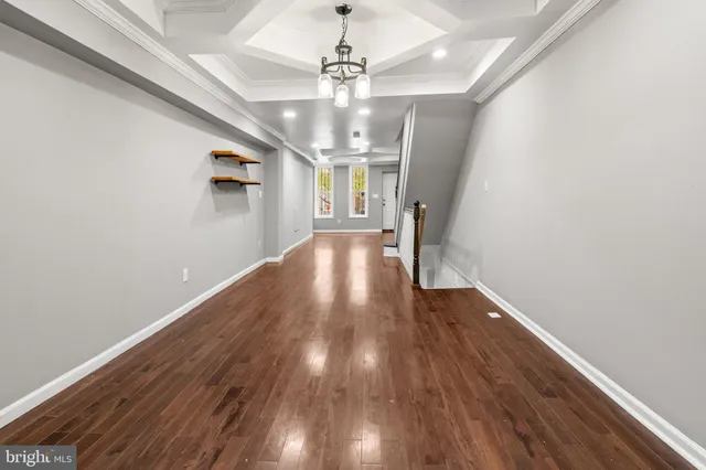 a view of livingroom with hardwood floor and hallway