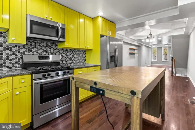a kitchen with a stove and a microwave