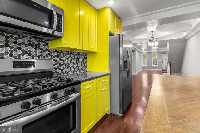 a kitchen with a stove and a microwave