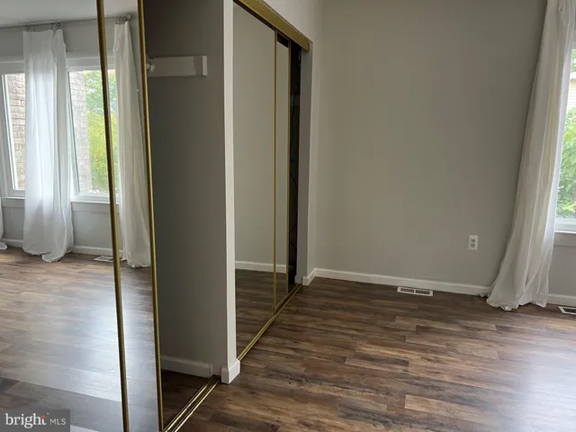 a view of entryway with wooden floor