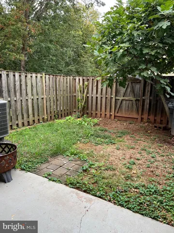 a garden view with wooden fence