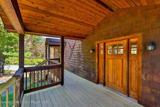 a view of a porch with wooden floor and outdoor space