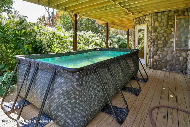 a view of a backyard with sitting area