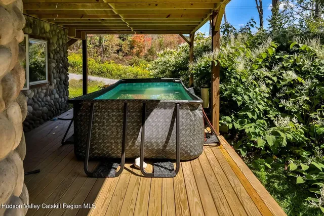 a view of balcony with wooden floor