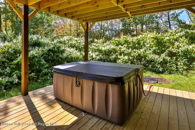a view of a balcony with wooden floor