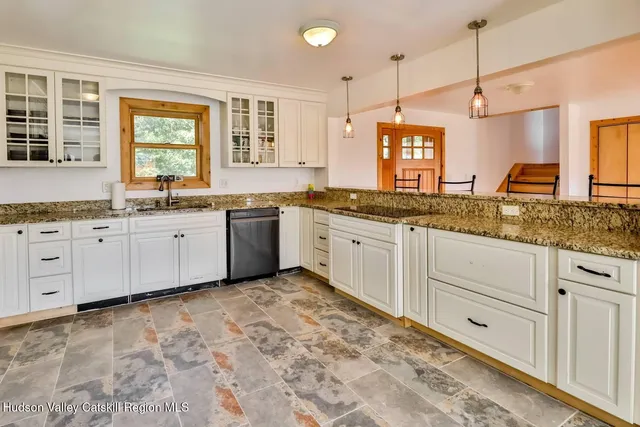 a kitchen with sink and window