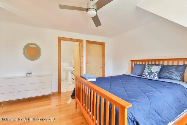 a bedroom with a bed and a dresser