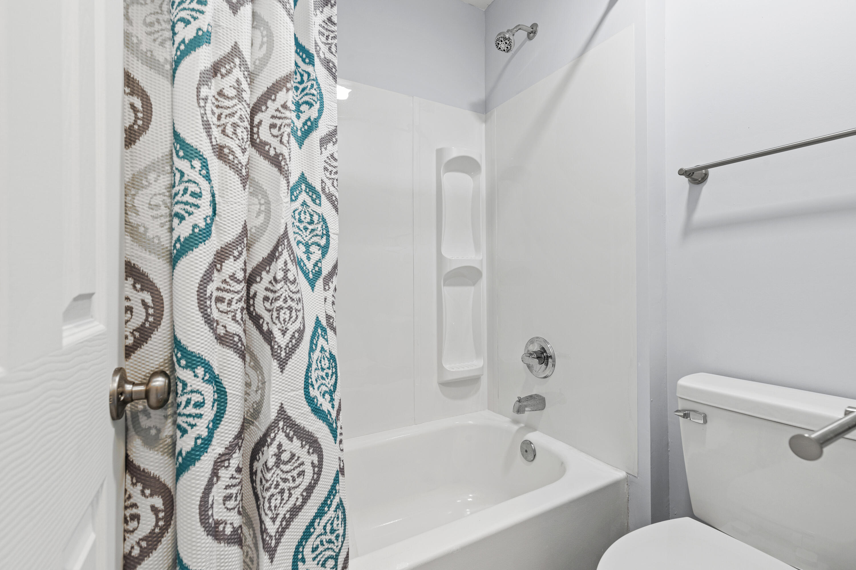 210 Pelham Road, Unit 109B Fort Walton Beach, FL 32547 - Photo 13 of 33 a bathroom with a bathtub and shower